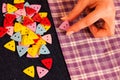 Bunch of colorful buttons in woman's hands over jeans textile Royalty Free Stock Photo