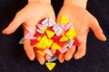 Bunch of colorful buttons in woman's hands over jeans textile Royalty Free Stock Photo