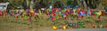 Bunch of colorful children windmill toys on a field