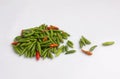 Bunch of colorful chili peppers isolated on white