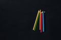 A bunch of colorful crayons on a black background, shot from above Royalty Free Stock Photo