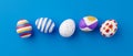 Bunch of colorful eggs on a blue Easter background 3D Rendering. Pile of birght and colorful Easter Eggs - 3d render. Easter