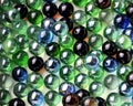 Bunch of colorful glass marbles on the white background. Royalty Free Stock Photo