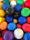 A bunch of colorful mini-golf golf balls