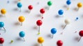 A bunch of colorful pins on a white background