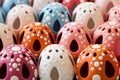 A bunch of colorful plastic eggs with holes in them, AI