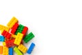 Lego background. Bunch of Colorful Plastick constructor bricks on white background. Popular toys. Copyspace