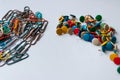 Bunch of colorful thumbtacks and many multi-colored paper-clips organize desktop and home office supplies as well as paperwork Royalty Free Stock Photo