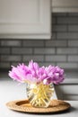 Bunch of crocus flowers in a glass vase in the kitchen. Royalty Free Stock Photo