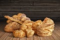 Bunch of Croissant Puff Pastry with Sesame Seeds on Bamboo Place