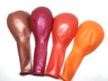Bunch of Deflated or Flat Metallic Balloons on White Background Royalty Free Stock Photo