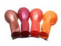 Bunch of Deflated or Flat Metallic Balloons on White Background Royalty Free Stock Photo