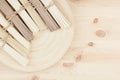 Bunch of different raw japanese noodles on wooden dish on beige board, top view.