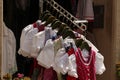 Bunch of dirndl dresses of various colors hanging on a rack in a market Royalty Free Stock Photo