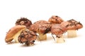 A bunch of dirty, unpeeled standing on tube Suillus mushrooms isolated on a white background. Selective focus