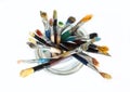 Bunch of dirty used paint brushes.  Colorful drawing accessory. Above view Royalty Free Stock Photo