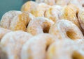 Bunch of Doughnuts Cruller with White Powder Sugar Topping. Sweet Potato Donut.