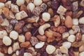 A bunch of dried fruits and nuts. Texture, background. Pile of raisins. Health food concept. Vegetarian diet