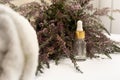 bunch of dried lavender flower branches empty glass cosmetic bottle with essential oil pipette and terry towel Royalty Free Stock Photo