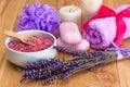 bunch of dried lavender flowers, pink soap and sea salt with lavender aroma, spa objects Royalty Free Stock Photo