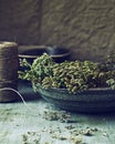 Bunch of dried wild oregano in an old bowl Royalty Free Stock Photo