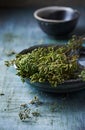 Bunch of dried wild oregano in an old bowl Royalty Free Stock Photo