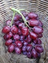 Bunch of eed fresh ripen sweet organic grapes in bamboo basket