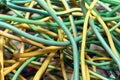 A bunch of electric yellow-green wires or cables crossed with each other. Royalty Free Stock Photo