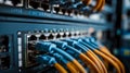A bunch of ethernet cables connected to a server in a server room Royalty Free Stock Photo