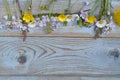 Bunch of fieldflowers,daisies, buttercups, Pentecostal flowers, dandelions on a oldwooden background with empty copy space