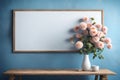 With a bunch of flowers atop a wooden shelf and a blank canvas above a blue wall, this interior decorating background