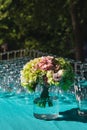 Bunch of flowers, champagne and wine glasses on a decorated table at wedding reception. Wine tasting Royalty Free Stock Photo