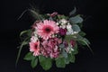 A bunch of flowers with Gerberas, roses and hydrangeas on black background