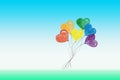 Bunch of flying heart shaped balloons in colors of LGBTQ flag. Rainbow colors as symbol of LGBT gay Pride. LGBT Pride Month Royalty Free Stock Photo