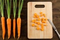 Bunch of fresh carrots with green leaves on wooden . Cooking carrot salad. Royalty Free Stock Photo