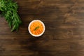 Bunch of fresh carrots with green leaves on wooden . Cooking carrot salad. Royalty Free Stock Photo