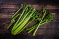 Bunch of fresh celery stalk with leaves on wooden background Royalty Free Stock Photo