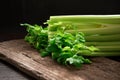 Bunch of fresh celery stalk on wooden table with leaves on black background. Food and ingredients  of healthy vegetable. Freshness Royalty Free Stock Photo