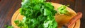 bunch of fresh cilantro on the boards, fresh herbs on wooden table. Royalty Free Stock Photo