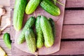 A bunch of fresh cucumbers, dill and garlic on a wooden table Royalty Free Stock Photo