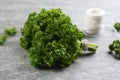 Bunch of fresh curly parsley on grey table