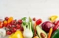 A bunch of fresh different seasonal green vegetables avocado, fennel, garlic, onion, tomato, red yellow pepper from above. Royalty Free Stock Photo