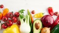 A bunch of fresh different seasonal green vegetables avocado, fennel, garlic, onion, tomato, red yellow pepper from above. Royalty Free Stock Photo