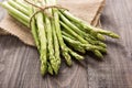 Bunch of fresh green asparagus on a rustic wooden table Royalty Free Stock Photo