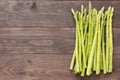 Bunch of fresh green asparagus on a rustic wooden table Royalty Free Stock Photo