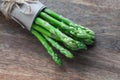 Bunch of fresh green asparagus on a wooden background Royalty Free Stock Photo