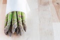 Bunch of fresh green asparagus on wooden table, horizontal, copy