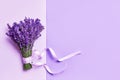 Bunch of fresh lavender flowers decorated with ribbon. Violet flowers. Greeting floral card with place for text. Top view, copy Royalty Free Stock Photo