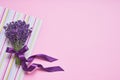 Bunch of fresh lavender on pink background. Violet flowers. Greeting floral card with place for text. Flat lay, copy space Royalty Free Stock Photo