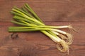 Bunch of fresh leeks on wooden table Royalty Free Stock Photo